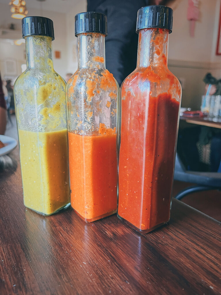 This is the 3 hot sauces of Chow, roja, verde, or habanero-carrot. I cant chose a favorite. they are all good. 